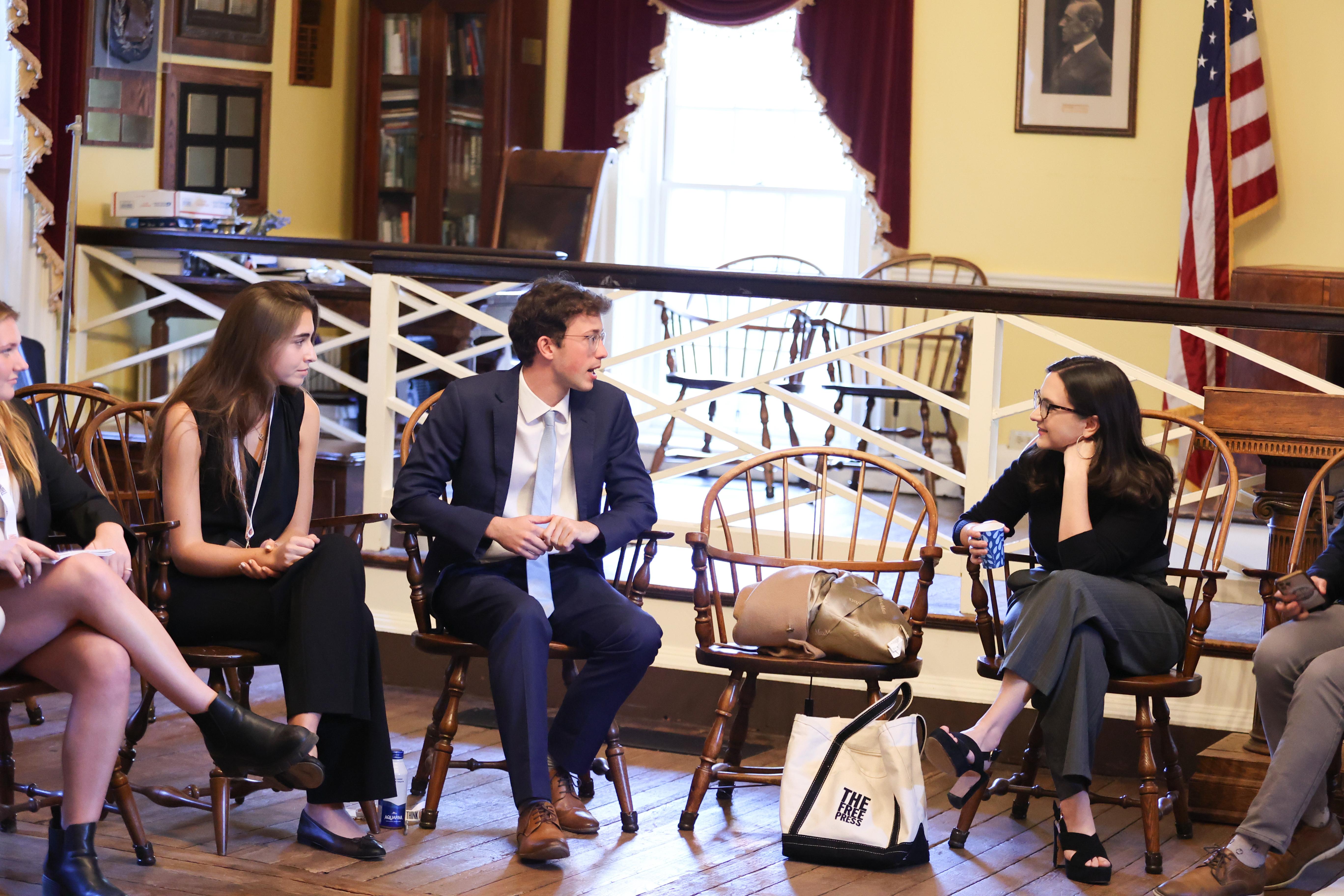 Students engaged in thoughtful discussion in academic setting