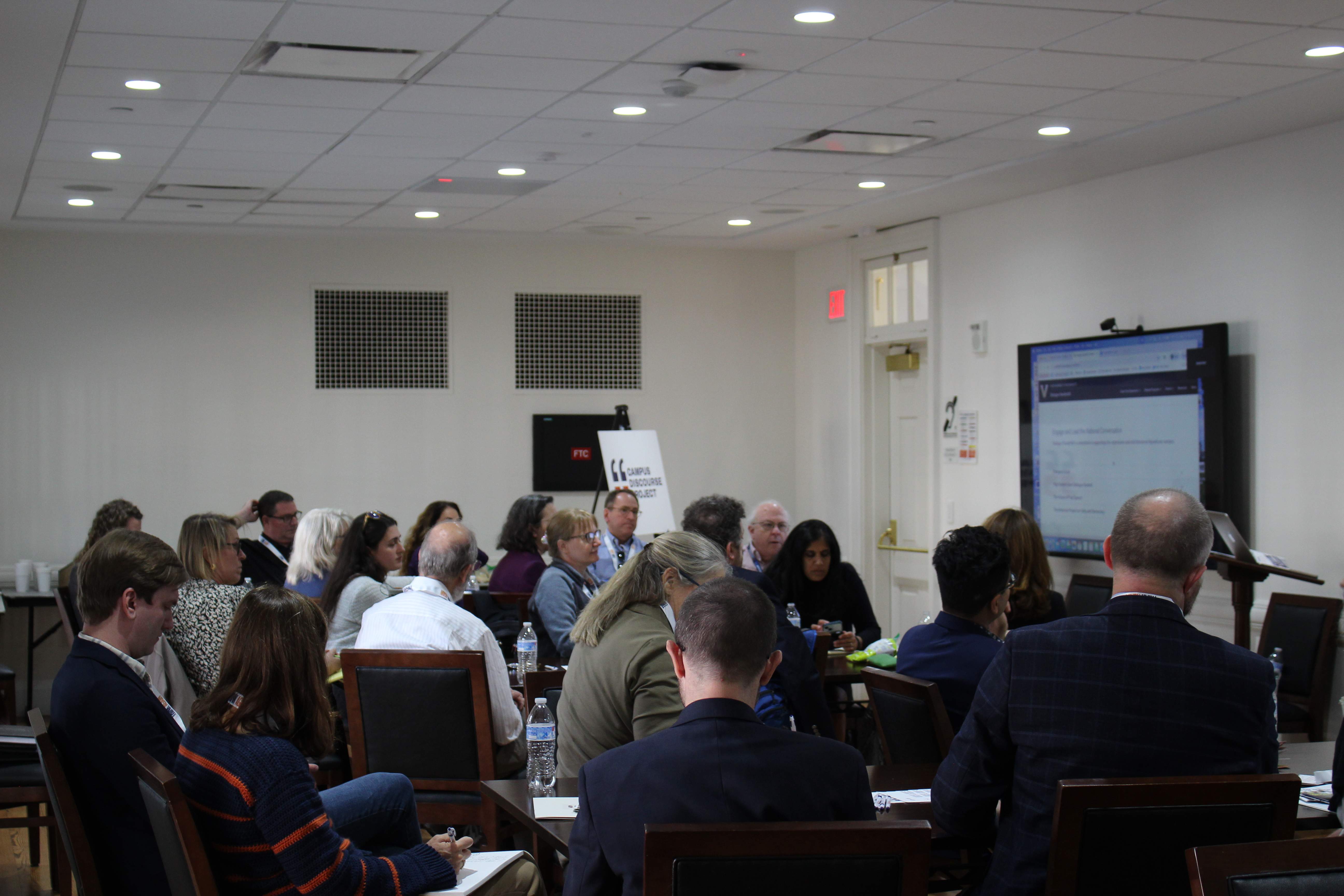 Conference room meeting with multiple participants