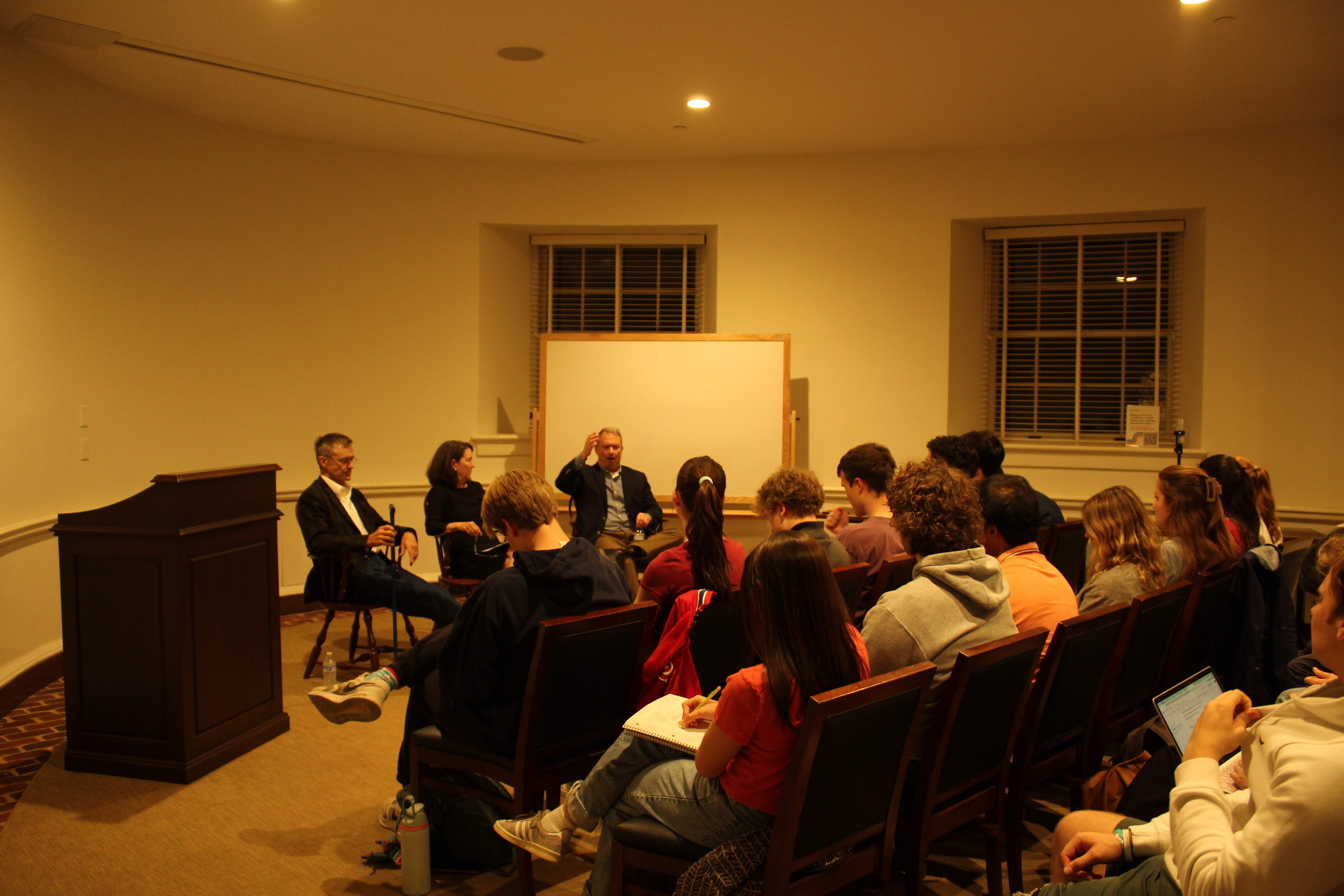 Classroom discussion with speakers and students